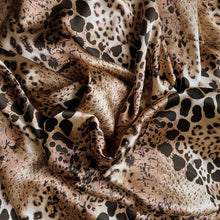 Load image into Gallery viewer, Tan, brown and black satin fabric in a leopard aftrican animal print displayed in a swirl.