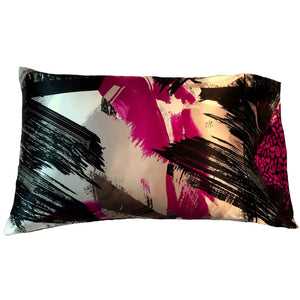 A satin pillowcase with modern magenta, black and white print. The pillow measures 12" x 16".