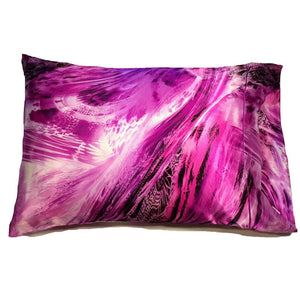 A purple, pink, black and white swirly print satin pillowcase.