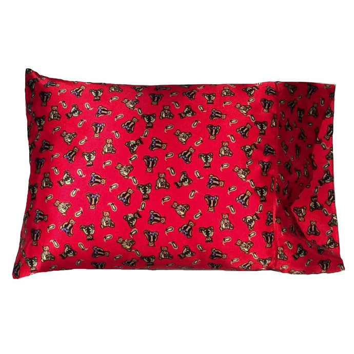A child's bedroom pillow with a red cover that has brown bears on it. The pillow measures 12