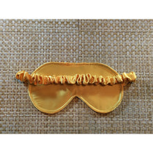 Load image into Gallery viewer, The back of the gold satin sleep mask showing the satin covered strap