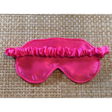 Load image into Gallery viewer, The back side of a bubblegum satin eye sleep mask showing pink satin covering the elastic strap.