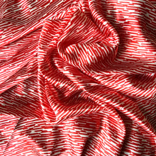 Load image into Gallery viewer, Red and white satin fabric with diagonal stripe in small squares throughout the fabric and displayed in a swirl.
