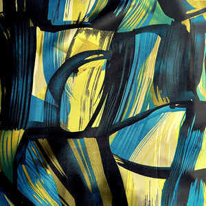Black, turquoise bue, green and gold abstract print shown flat to show the exact design of the pattern.