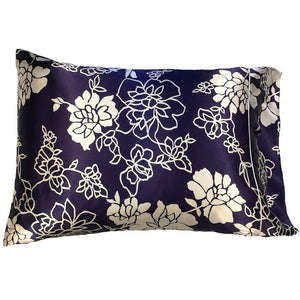 Navy blue satin pillowcase with a white flowers floral print.