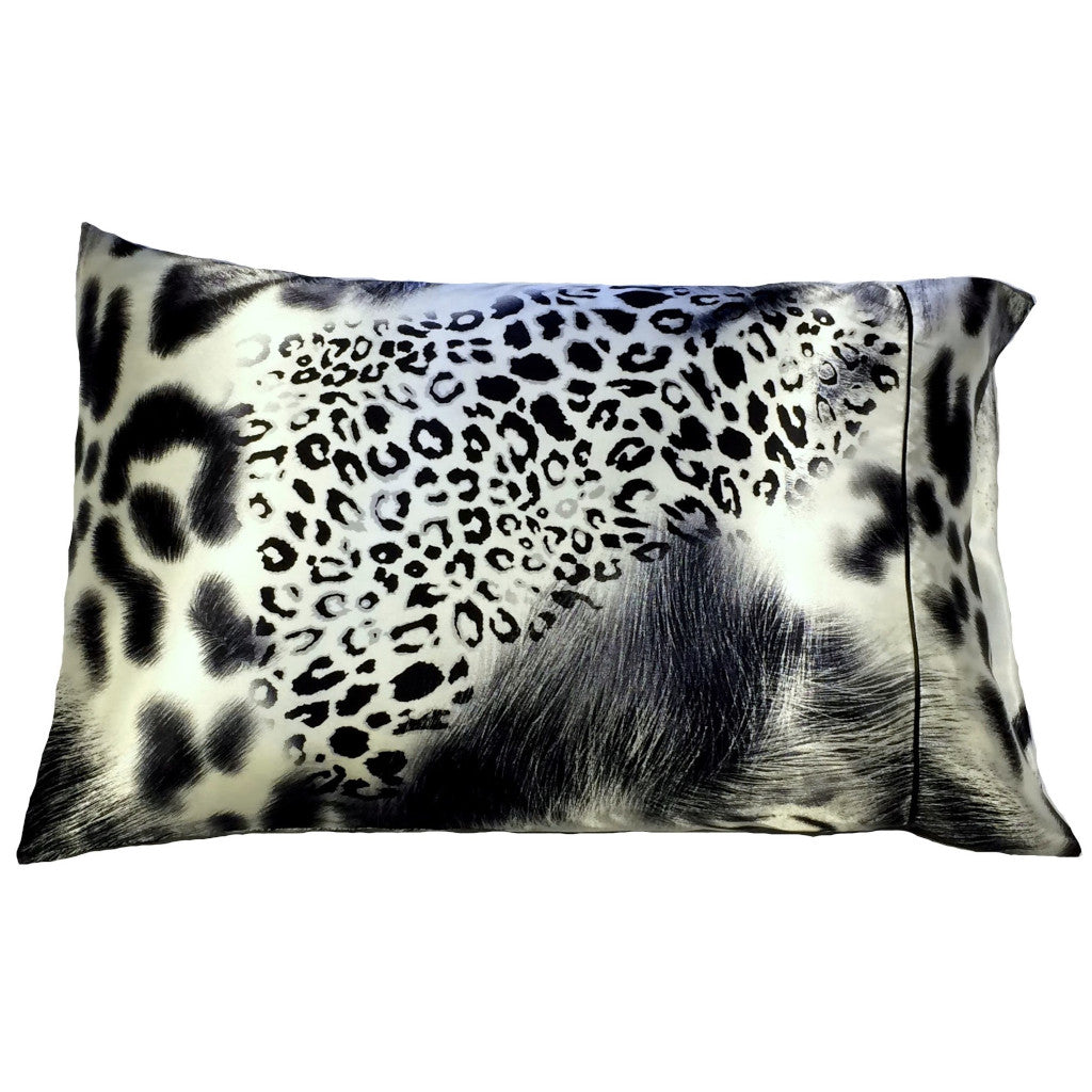 A leopard print satin pillowcase in a gray, white and black pattern,.