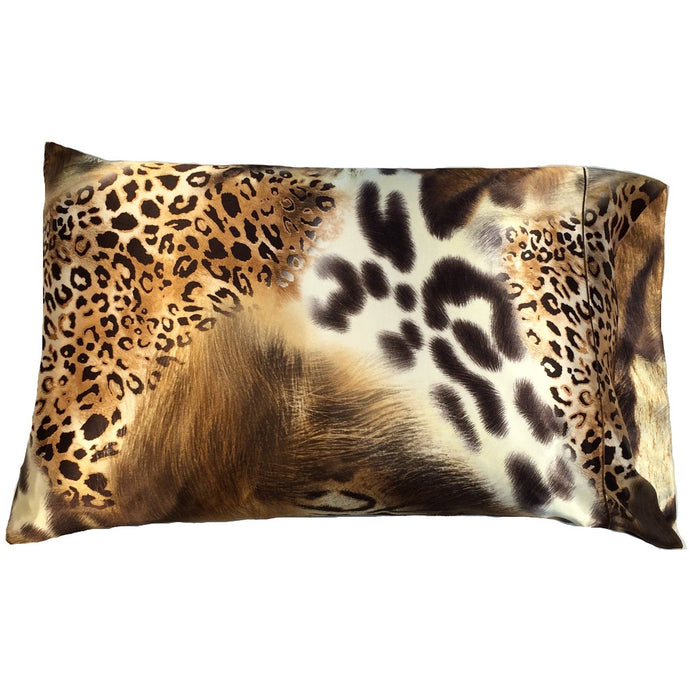 A satin pillowcase in a leopard print with a gold, white, brown and black pattern.