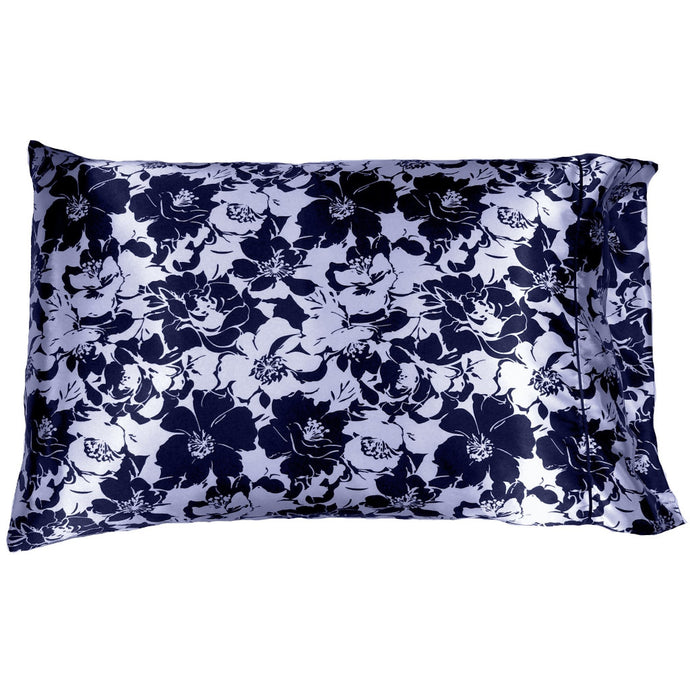 An accent pillow with a satin pillowcase cover. The satin pillowcase is navy blue and silver flowers.