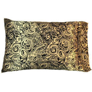 A boudoir pillow with a satin pillowcase in gold with black flowers and leaves. The pillow measures 12" x 16".