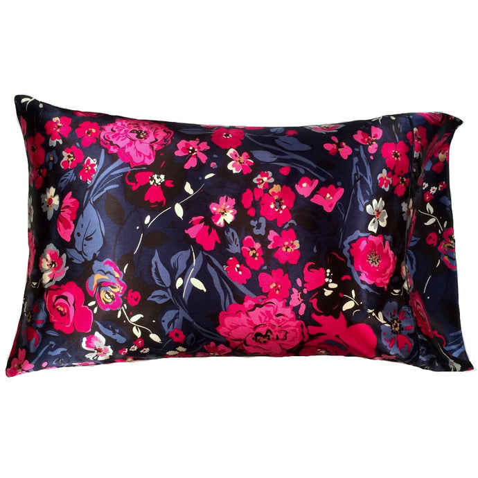 A navy blue with pink and white floral print satin pillowcase.