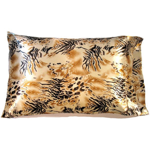 A gold, tan and black satin pillowcase. An African cheetah pattern.