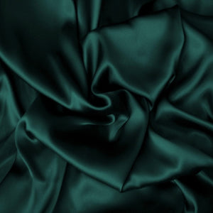 satin material in a solid hunter green color. The material is swirled.