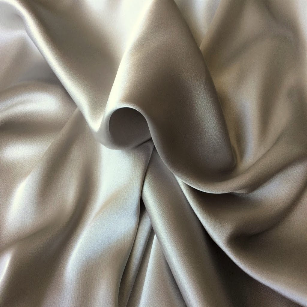 Satin material in a solid pewter color. The material is swirled.