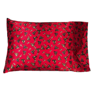 A child's bedroom pillow with a red cover that has brown bears on it. The pillow measures 12" x 16".