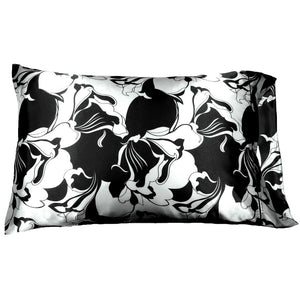An accent pillow with a black and white print cover. The pillow measures 12" x 16".