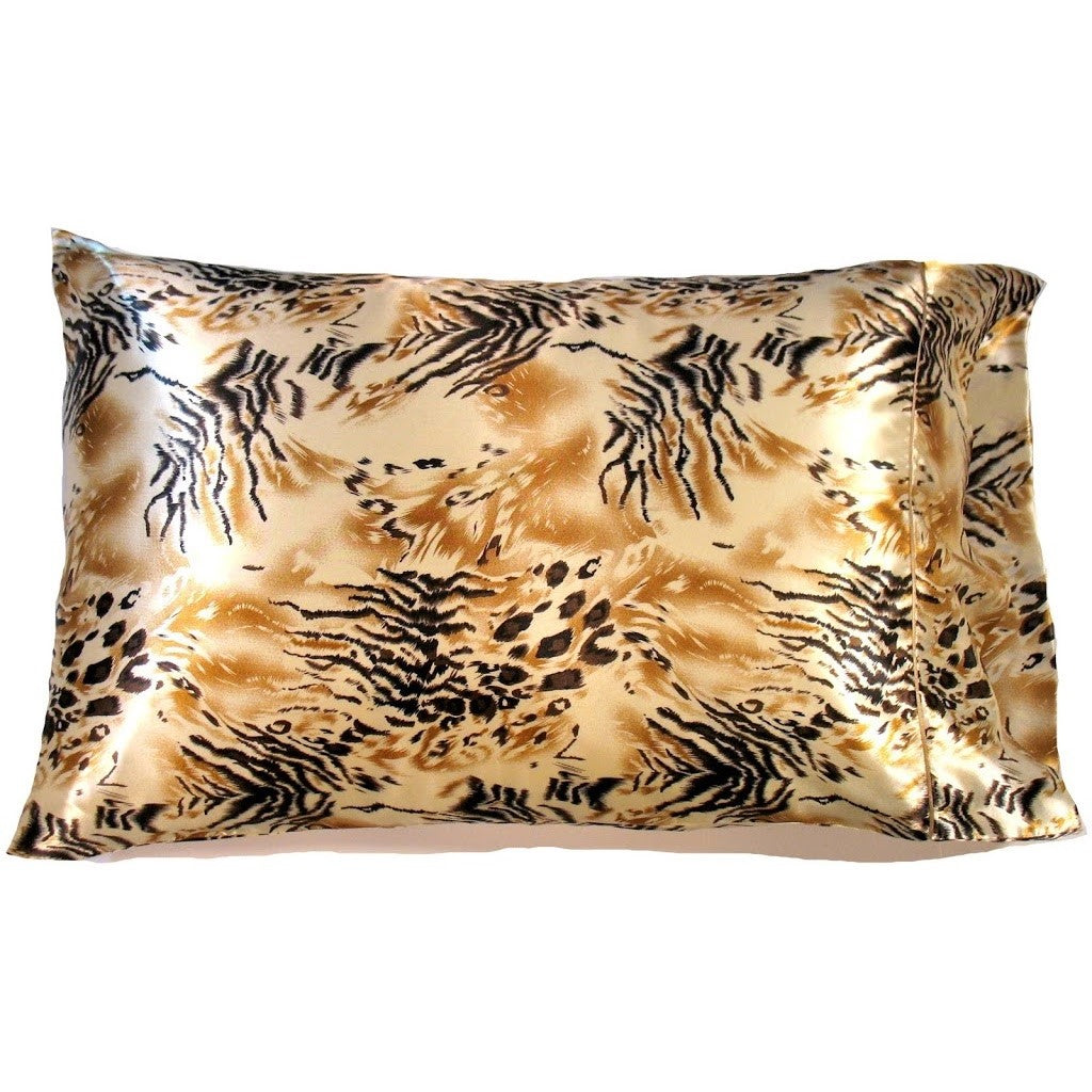 A bedroom accent pillow with a black and gold, African print cover. The pillow measures 12