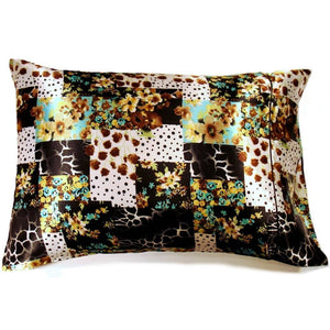 A modern rustic pillow with a patchwork animal print and floral design cover. The pillow measures 12" x 16".