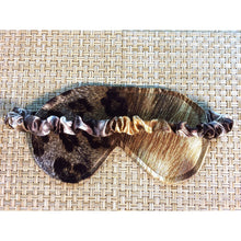 Load image into Gallery viewer, A picture of a leopard print satin sleep eye mask. The back of the mask has an elastic strap that is covered in brown leopard satin material.
