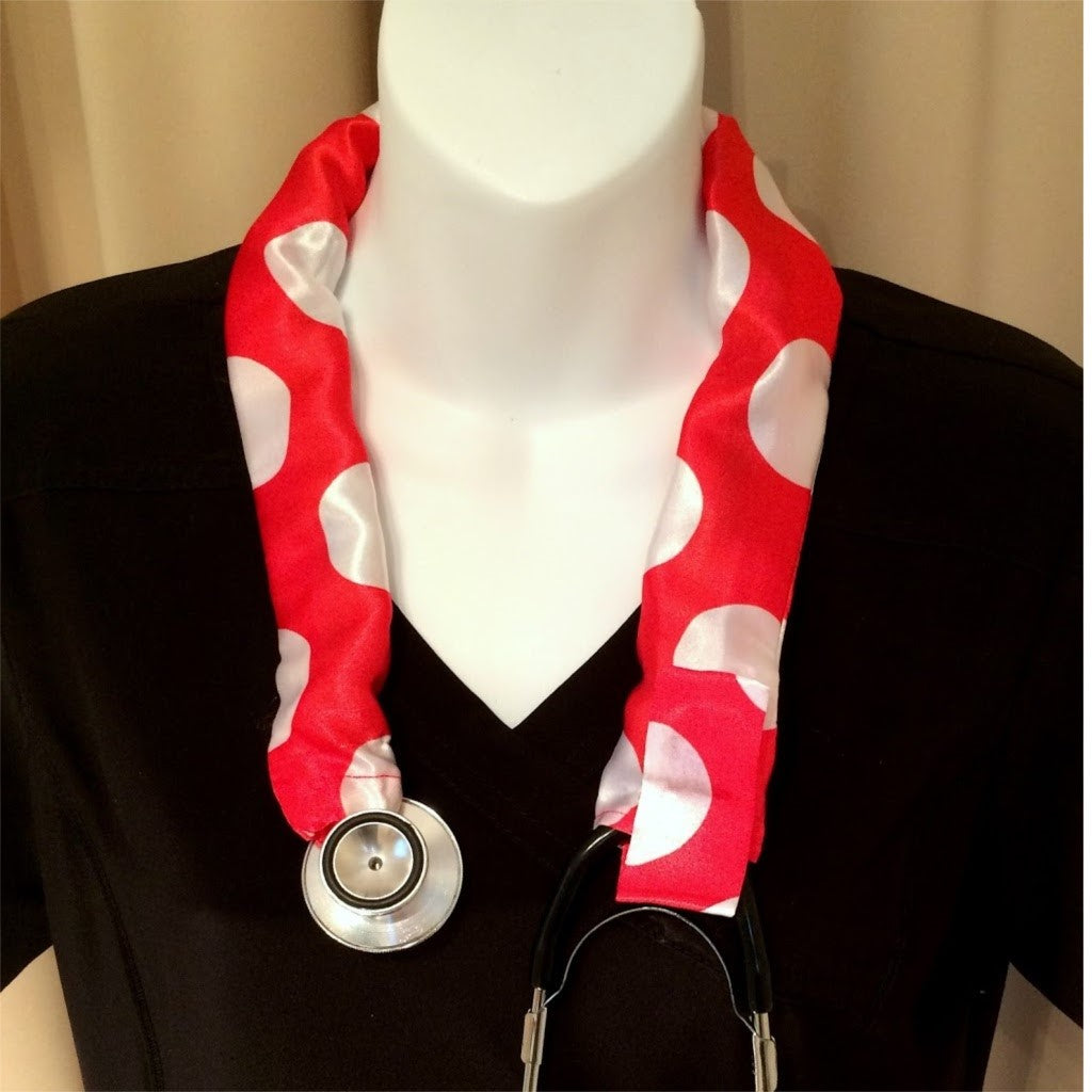 Our stethoscope cover is made from a red with white polka dots charmeuse satin print and is washable. The cover has a Velcro closing to keep it in place.