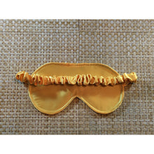 Load image into Gallery viewer, The back of the gold satin sleep mask showing the satin covered strap
