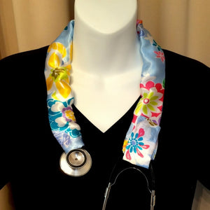 Our stethoscope cover is made from a yellow, blue and green flowers charmeuse satin print and is washable. The cover has a Velcro closing to keep it in place.