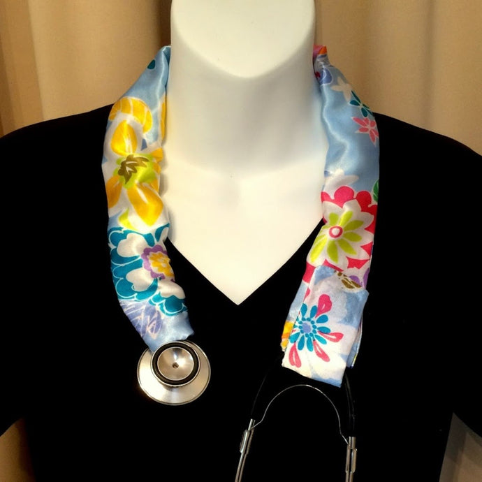 Our stethoscope cover is made from a yellow, blue and green flowers charmeuse satin print and is washable. The cover has a Velcro closing to keep it in place.