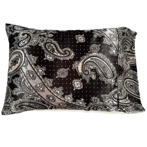 A decorative pillow with a black and gray paisley print cover. The pillow measures 12" x 16".
