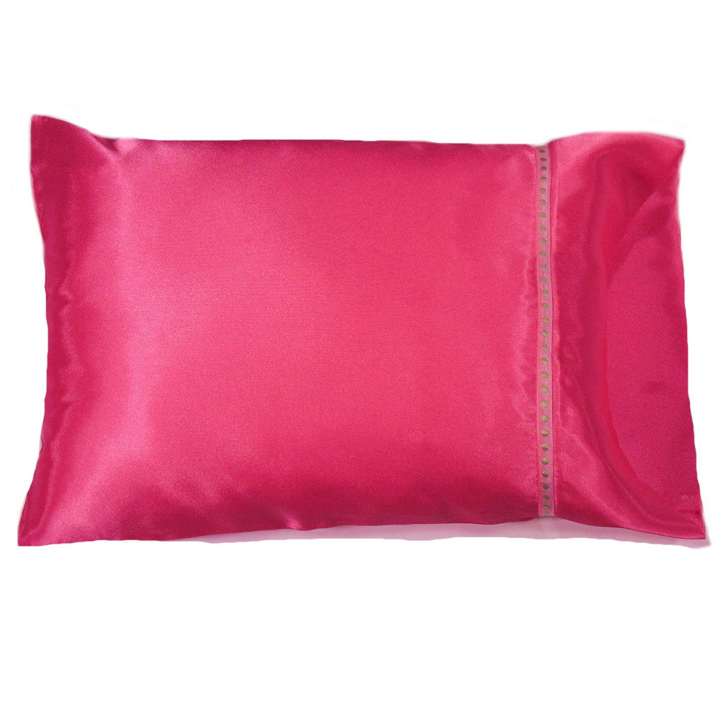 A bedroom pillow with a bubblegum pink solid cover. The pillow measures 12