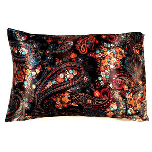 An accent pillow with a black satin cover that has a orange, white, turquoise blue and red paisley print. The pillow measures 12" x 16".