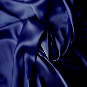 swirled satin material in a sapphire blue solid color.